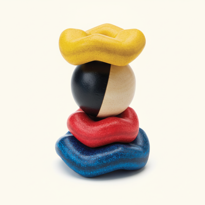 PlanToys Ball & Wave Stacker, four wave pieces and bell ball stacked, on a plain cream background